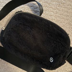 Lululemon everyday belt bag.  Shearling black with gold.  Never used.
